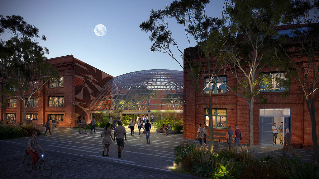 A group of people walking around a building.